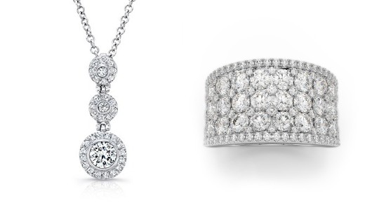 a three tiered diamond pendant necklace next to a fashion ring covered in diamonds