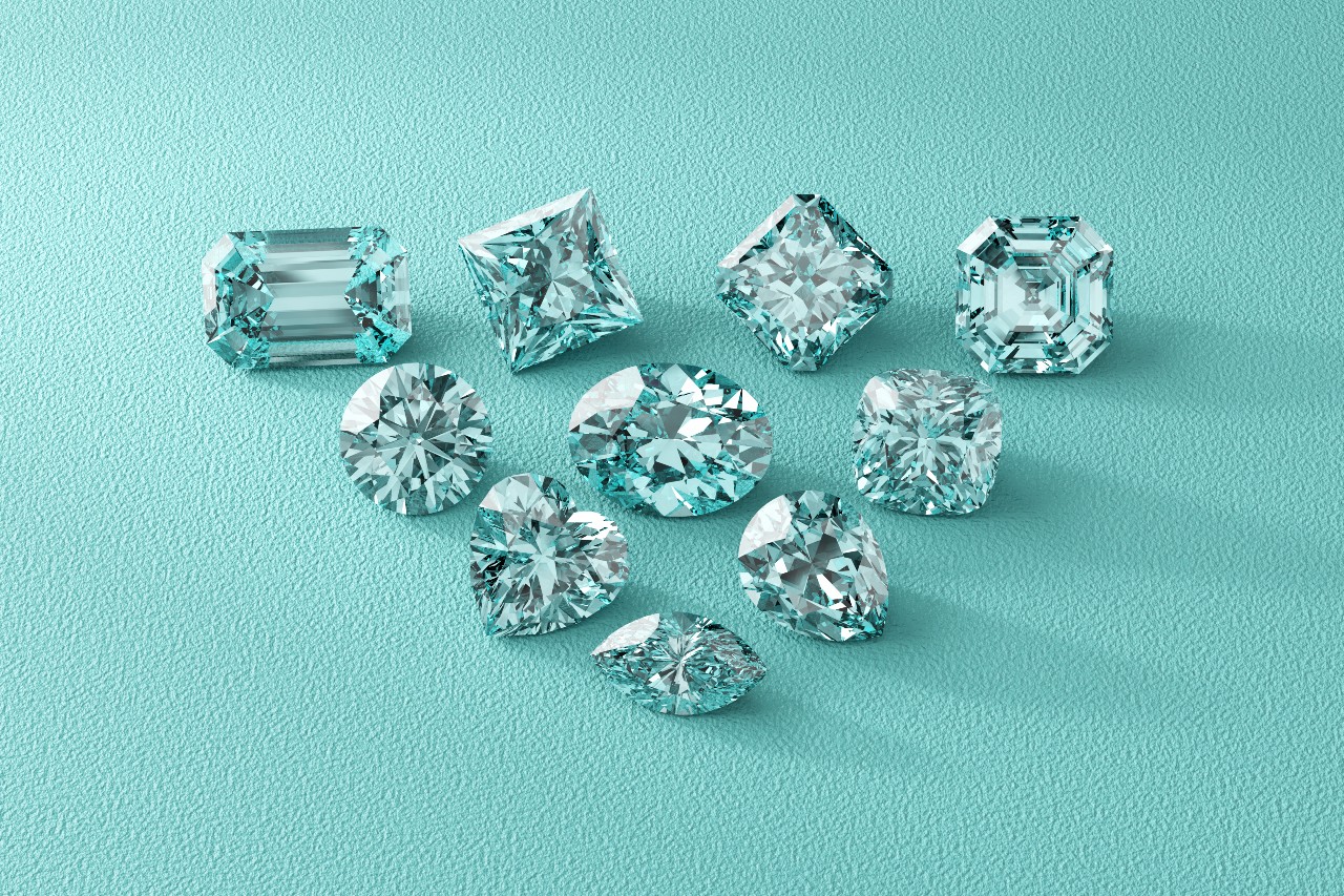 A collection of sparkling, multi-shaped diamonds on a teal textured background.