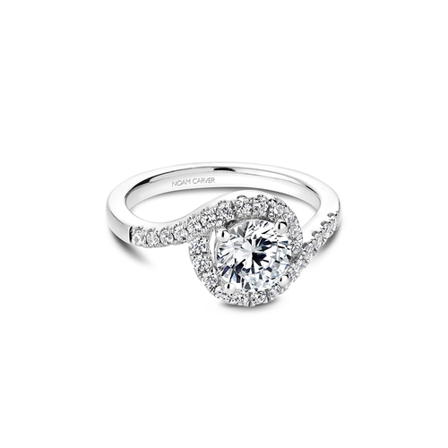 Silver engagement ring with a large central diamond surrounded by smaller diamonds.