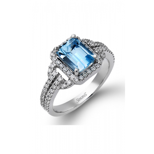 Elegant Simon G, ring with a large rectangular blue gemstone, surrounded by small sparkling diamonds on a silver band.