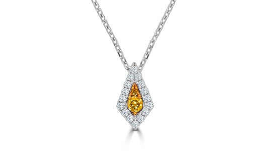 a white gold and diamond pendant featuring yellow diamonds at the center