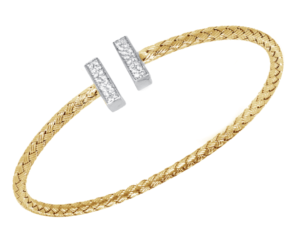 A yellow gold open bangle with diamond accents.