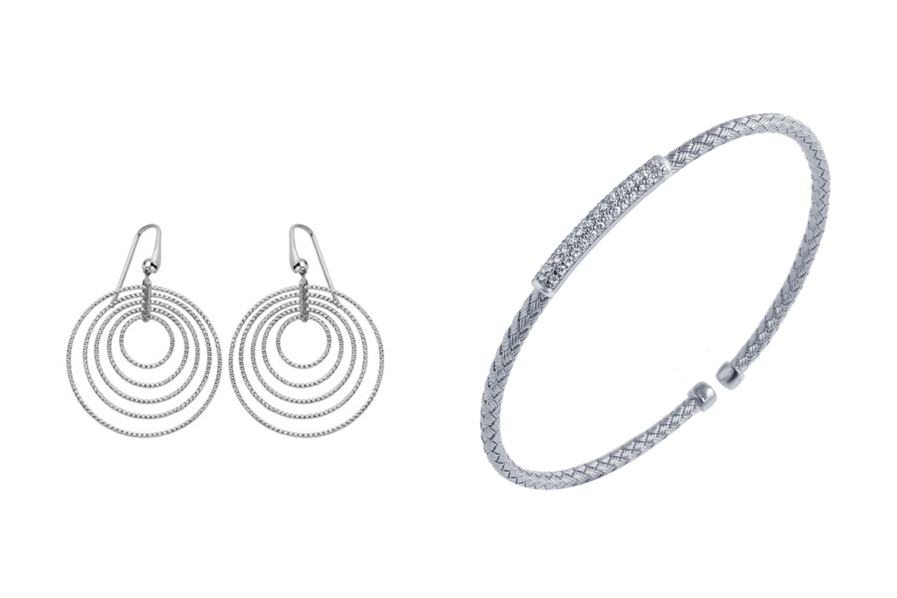 A combination of sterling silver round earrings and a cuff bracelet.