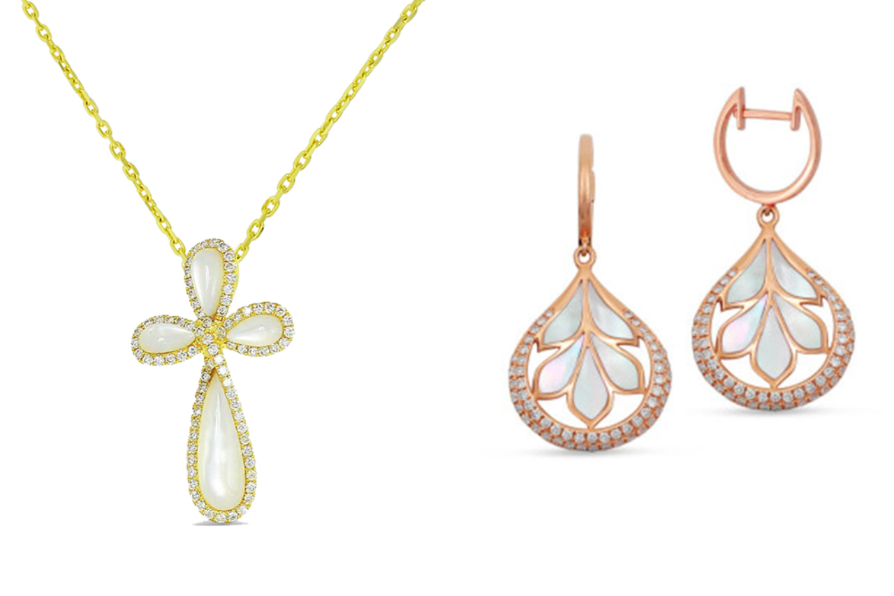 A yellow gold cross pearl necklace and rose gold drop earrings encrusted with diamonds and mother of pearls in the shape of leaves.