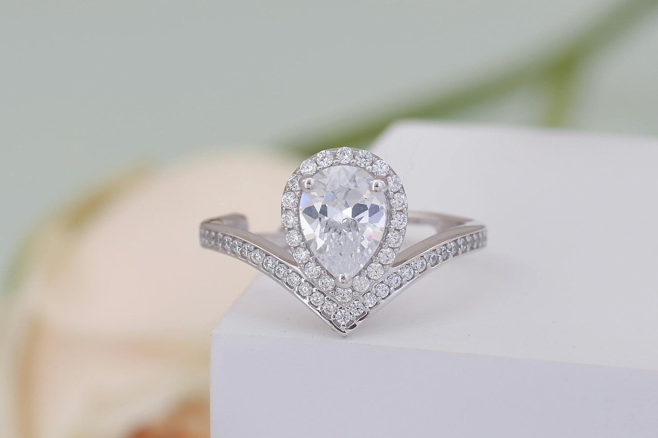 a pear shaped halo engagement ring